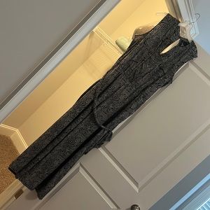 Black and white romper with pattern: like new